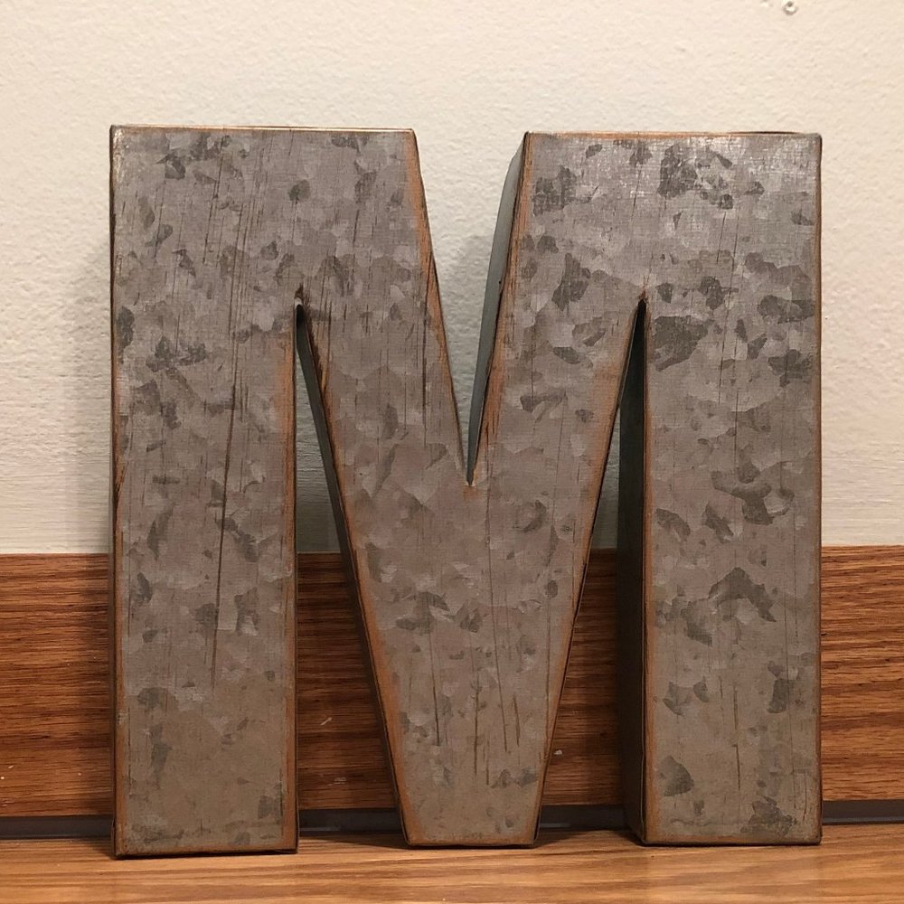 "M" decoration/sign